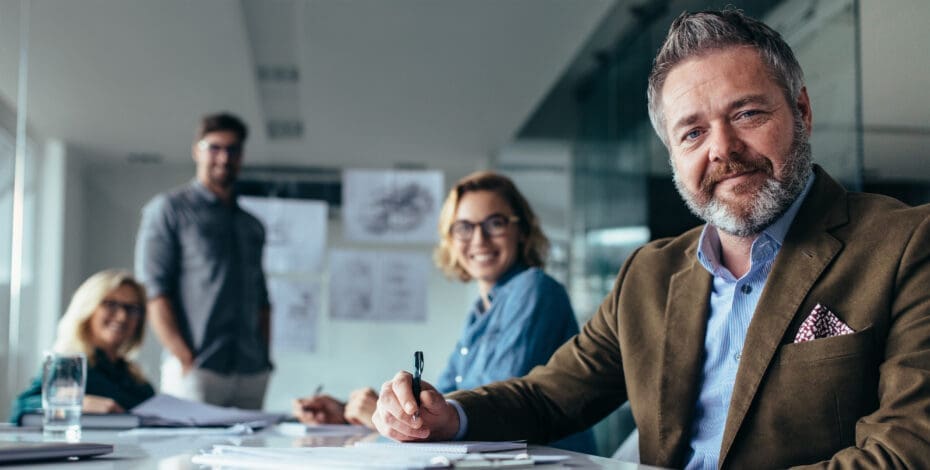 Businesspeople looking at camera with smile