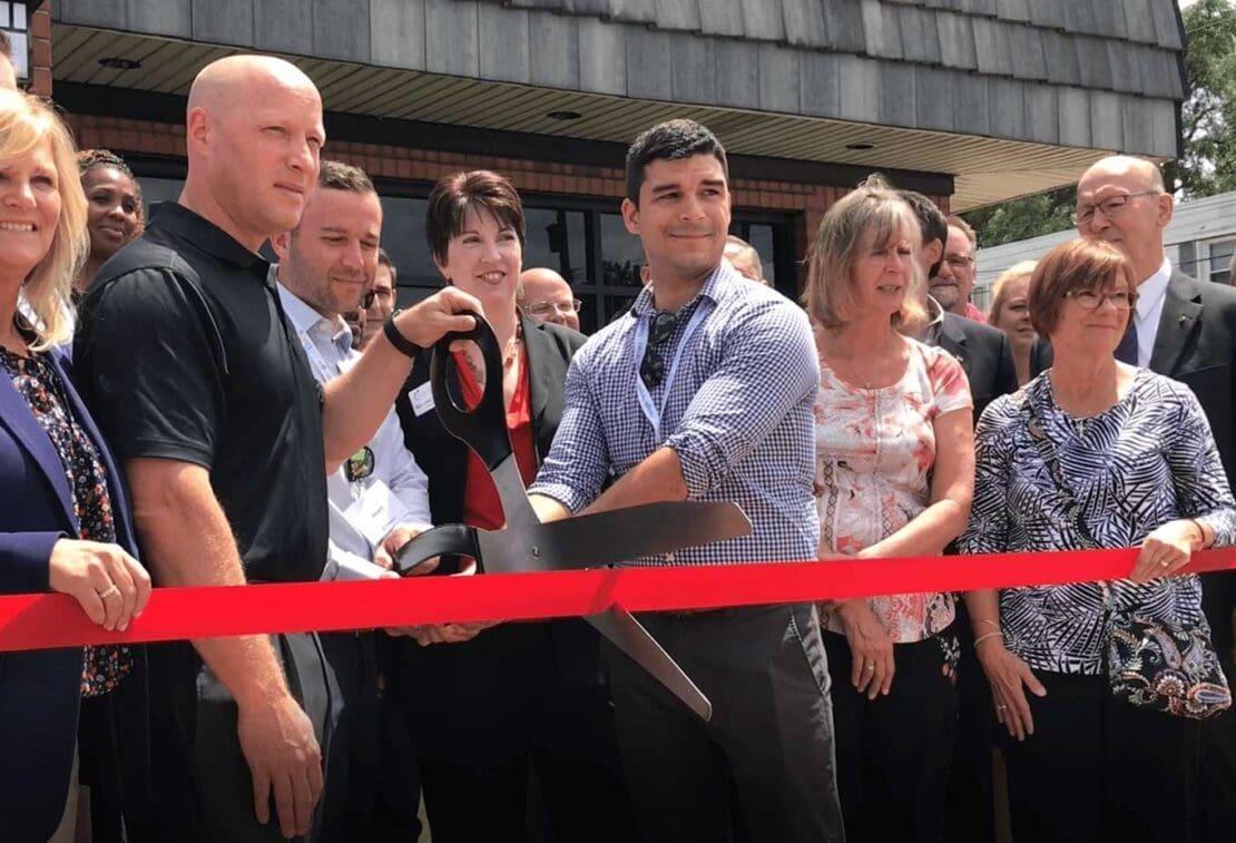 Cutting the ribbon at Momentum's new office