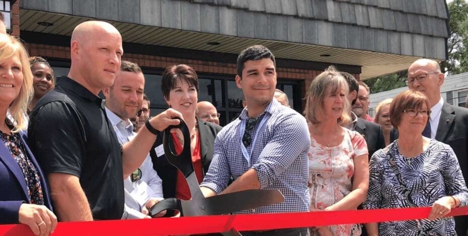 Cutting the ribbon at Momentum's new office