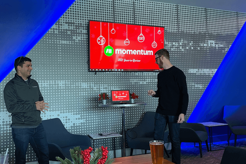 Momentum team giving 2021 Year in Review presentation at the 2021 Christmas party