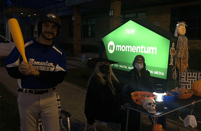 Momentum team handing out candy at the Trunk or Treat event