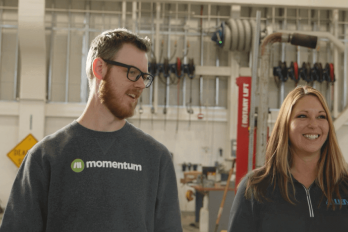 Allied Equipment employee touring facility with Momentum employee