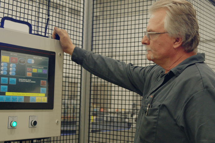 Eaglematic employee working on machine