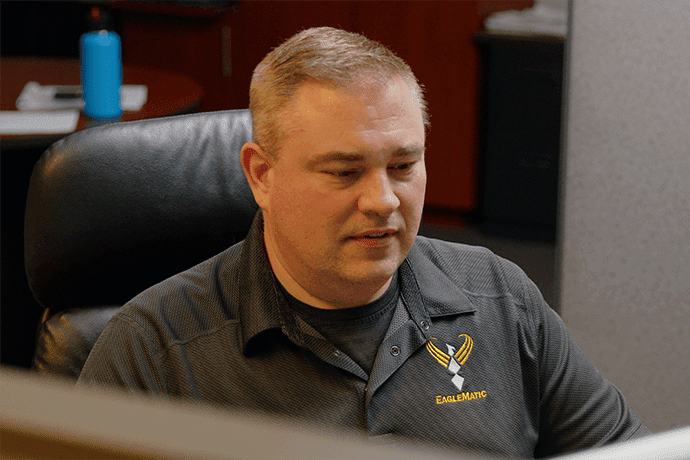 Eaglematic employee in the office at a computer