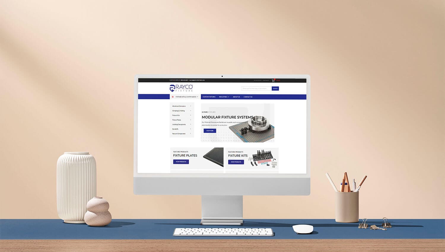Rayco Fixtures website on desktop monitor