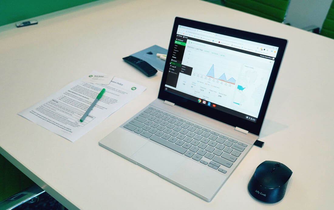 Laptop With Data Analytics on Desk