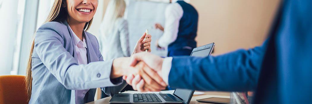 Close-up of business people handshaking