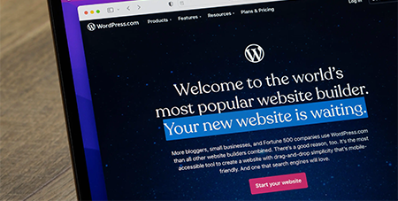 A laptop screen that shows the WordPress home page.