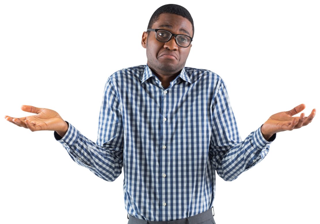 A stock image of a young man shrugging
