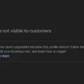 A screenshot of a message that reads "Your business is not visible to customers" and description that says "Your access has been suspended because this profile doesn't follow the guidelines. Edit your business info, and learn how to regain access."